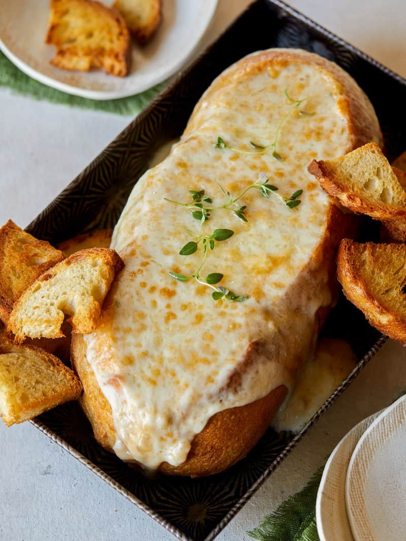 Creamy French Onion Soup Dip in a Bread Bowl Spoon Fork Bacon