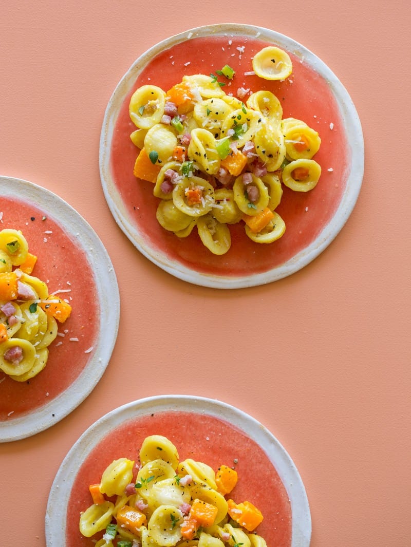Several plates of butternut squash and pancetta orecchiette.