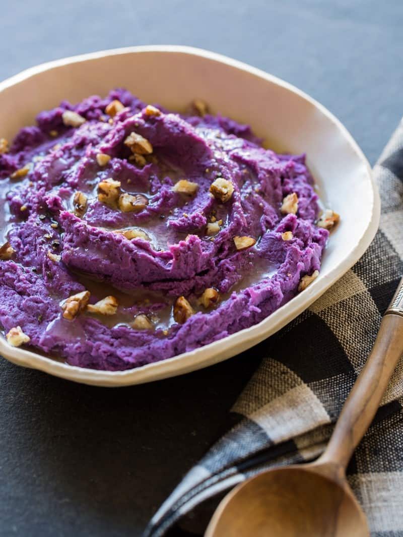 A recipe for Mashed Purple Sweet Potatoes with toasted pecans.