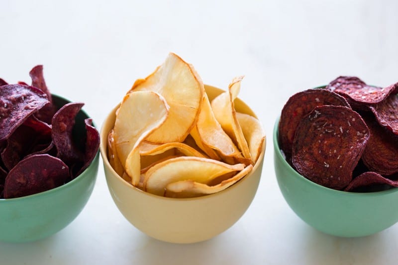 Yucca, purple sweet potatoes, and beets slices made into chips with salt.