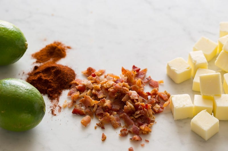 A close up of ingredients for bacon lime chili butter.