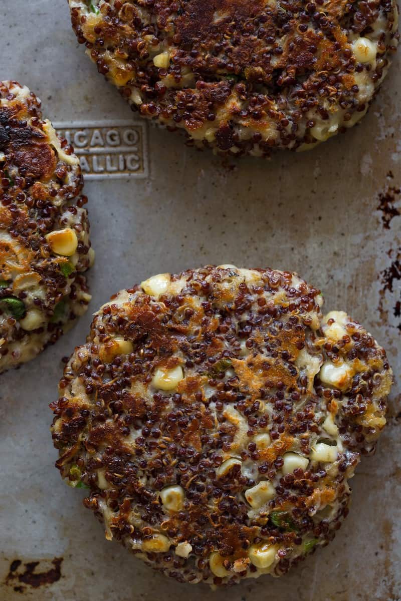 A close up of several big veg quinoa burger patties. 