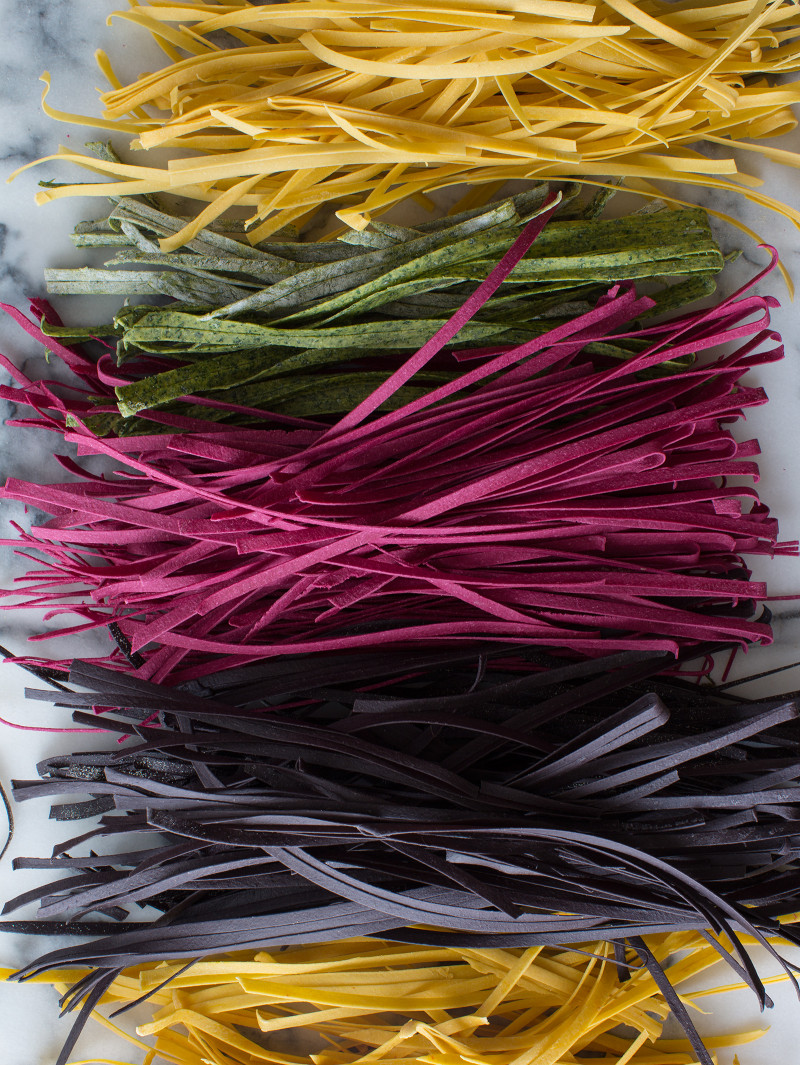 A colorful variety of homemade pastas lined up.