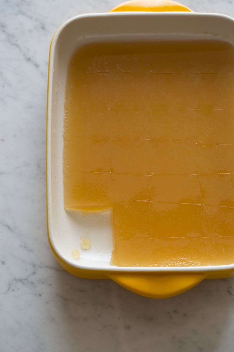 A pan of gelatinized stock with a square cut out.