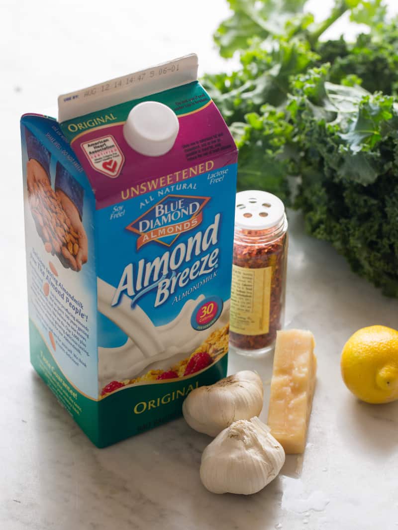 A carton of Blue Diamond almond milk and other ingredients for creamed kale.