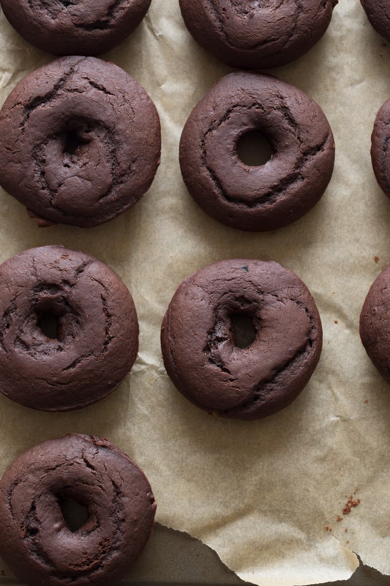 A close up of chocolate and cardamom baked doughnuts.