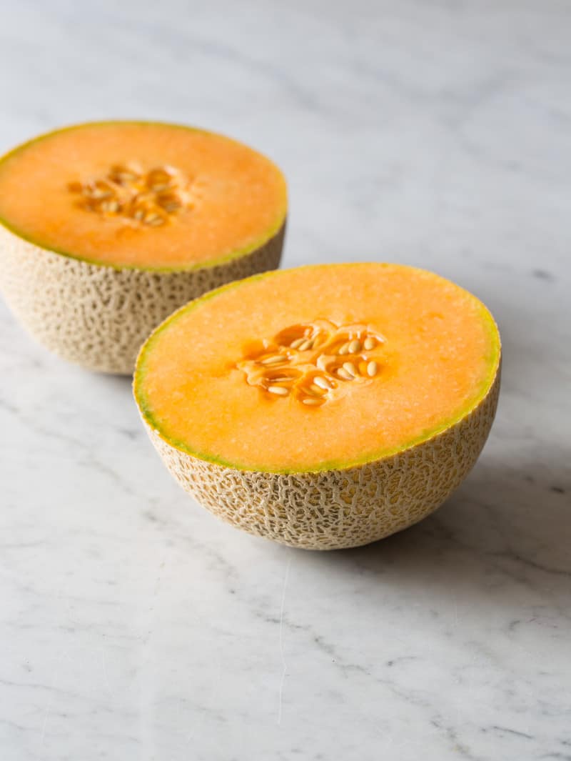 A cantaloupe sliced in half.