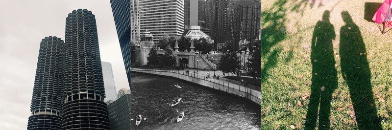 A bridge over water with a city in the background.