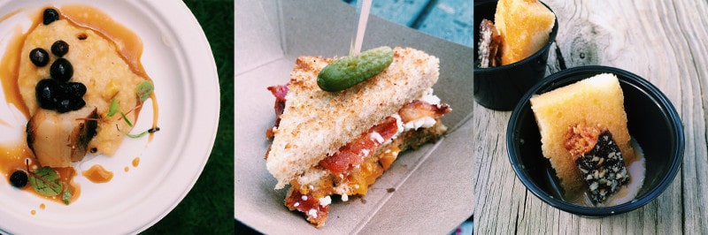 A close up of a pork sandwich skewered with a gherkin.