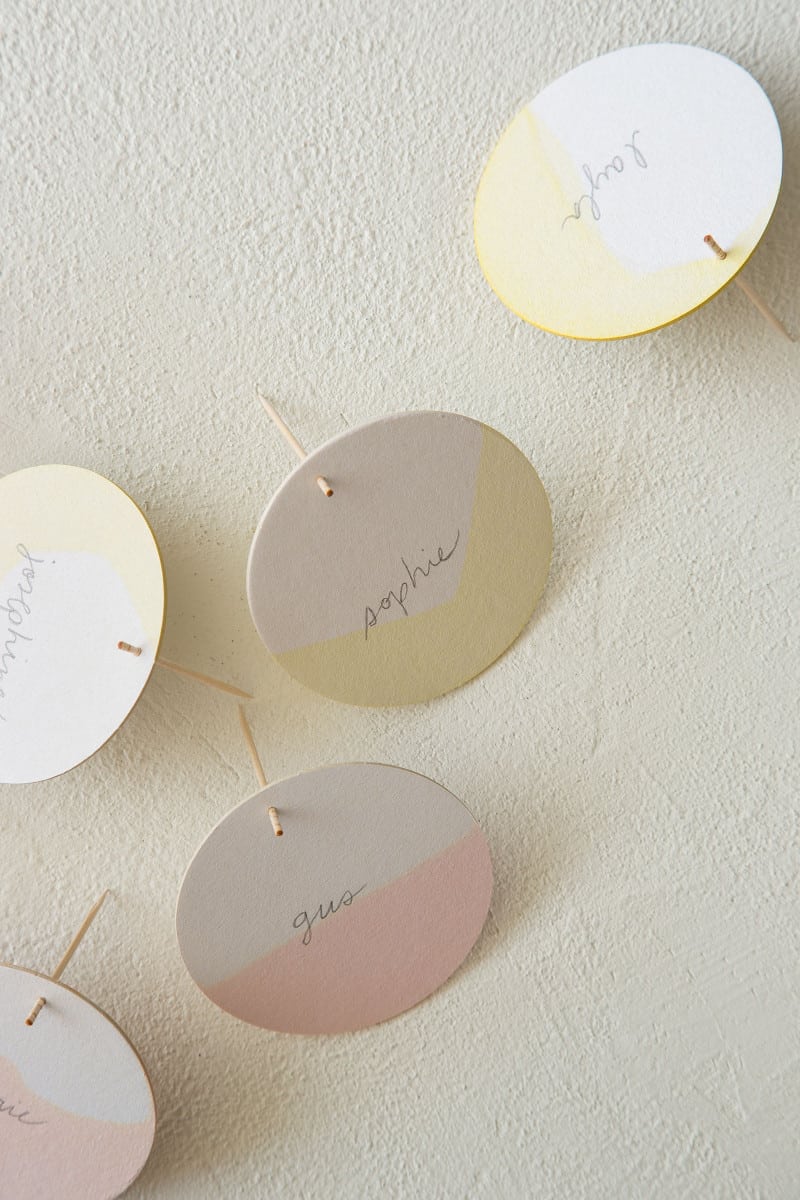 DIY dip dye place cards standing up with toothpicks.