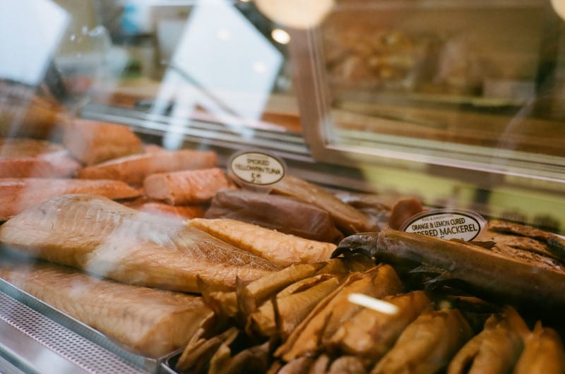 A close up of cured fish in a display case.