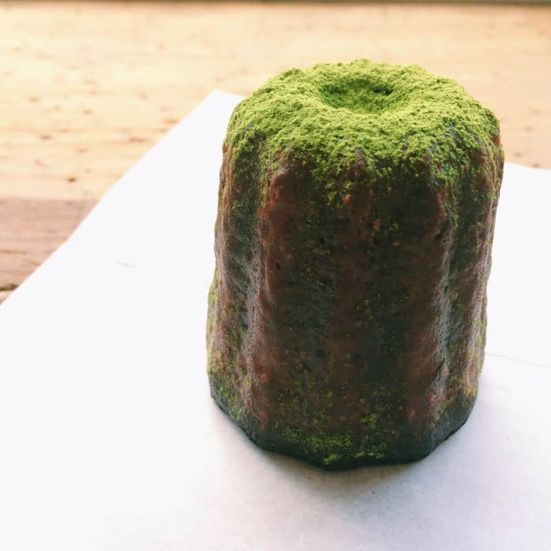 A close up of a matcha canele.