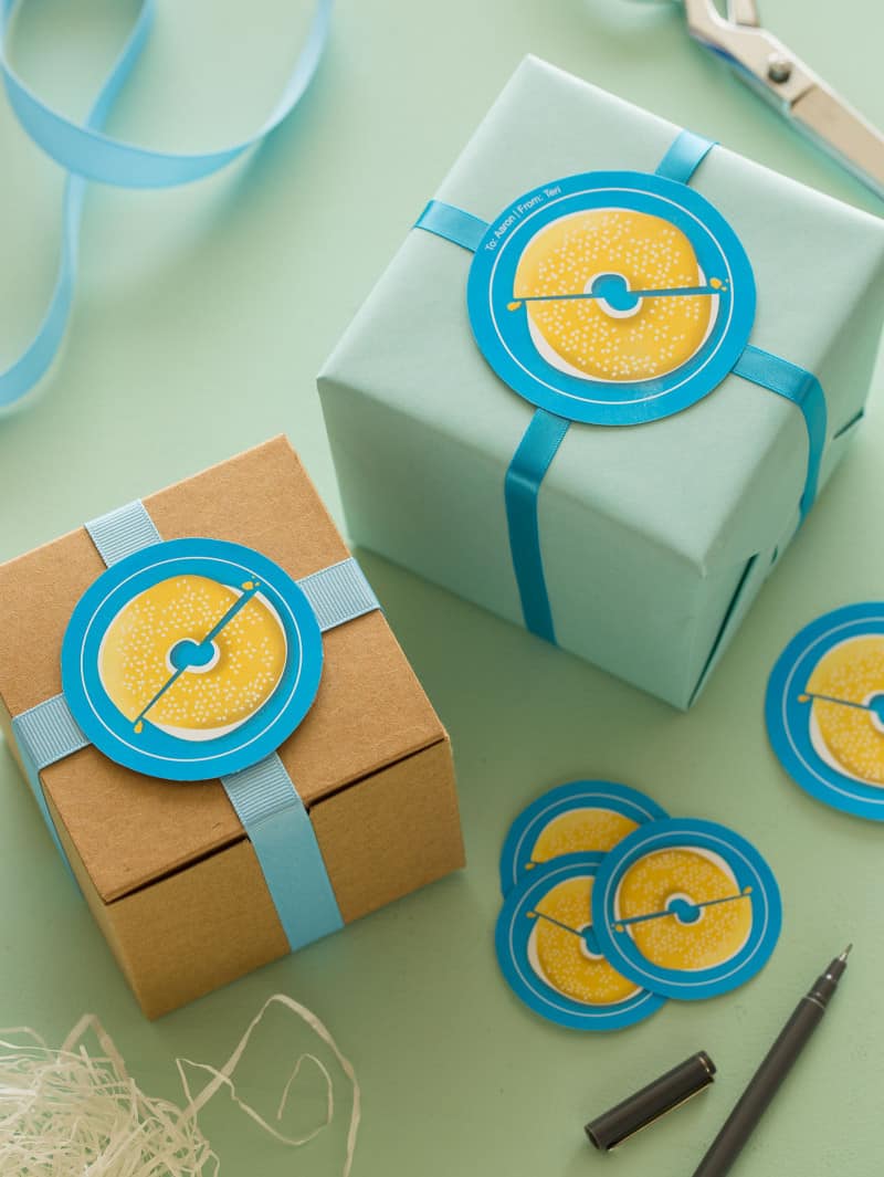 Blue bagel printable food gift tags on gift boxes.