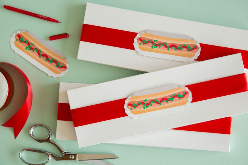 Hotdog printable food gift tags on gift boxes with scissors.