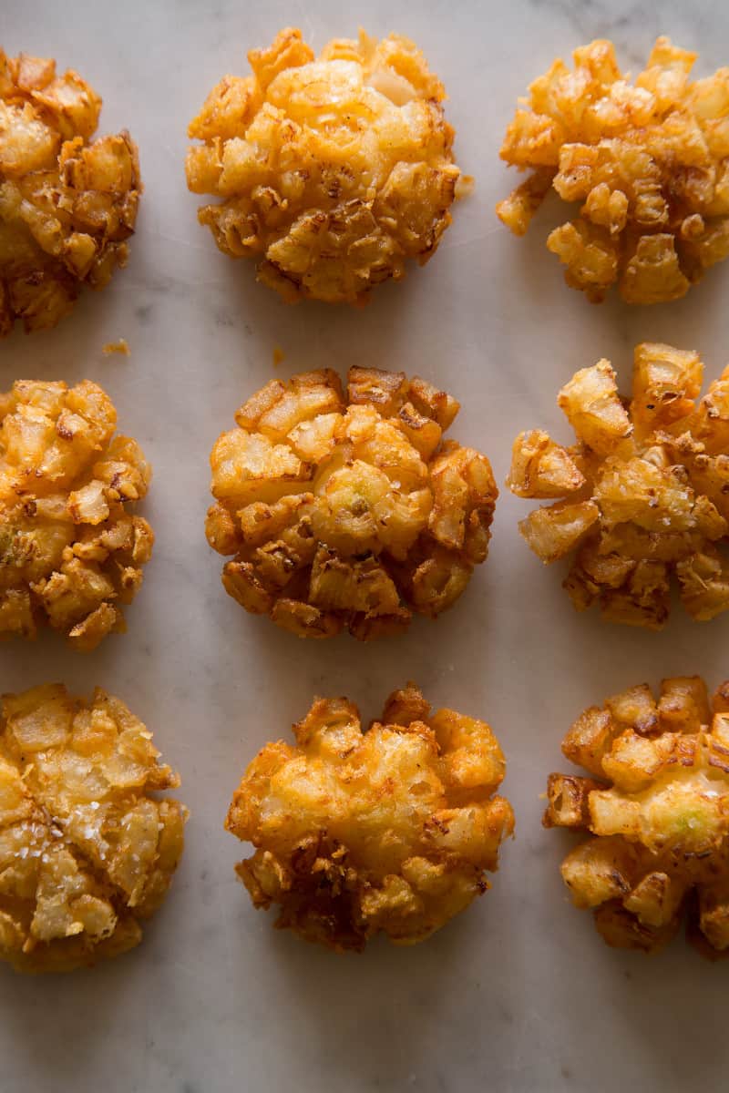 A close up of mini bloomin\' onions.