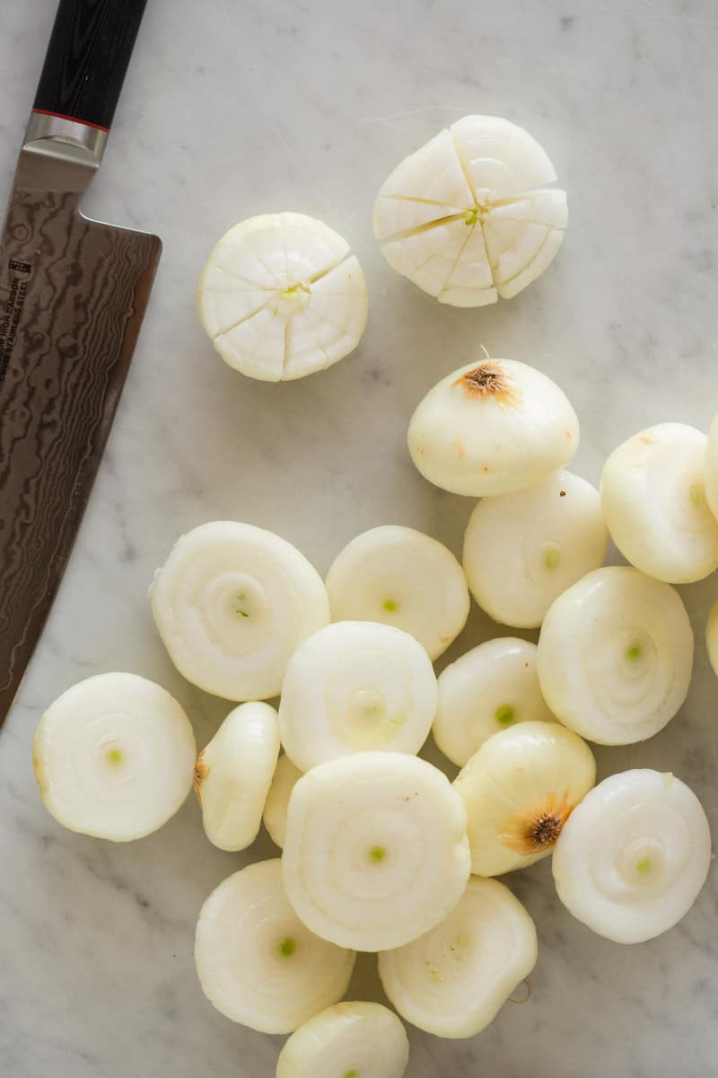 Onions cut and prepped for bloomin\' effect with a knife.