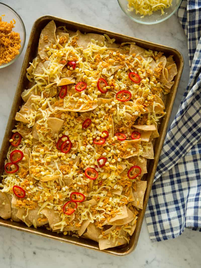 Carne Asada Nachos recipe A sheet pan of carne asada nachos before being baked.