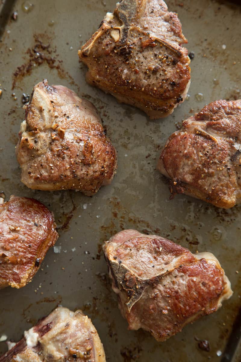 A close up of garlic and anchovy roasted lamb chops.