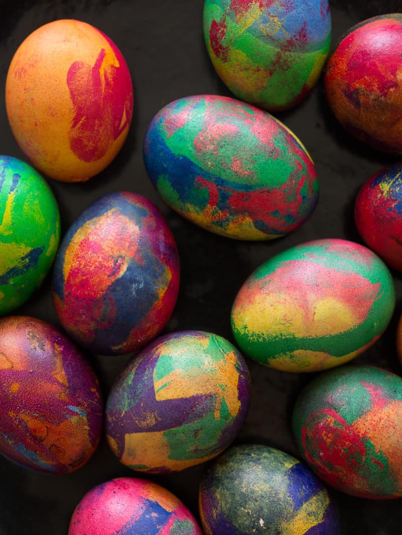 A close up of colorful painterly dyed Easter eggs.