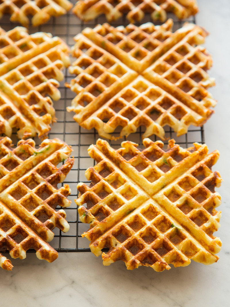 Green onion waffles on a drying rack. 