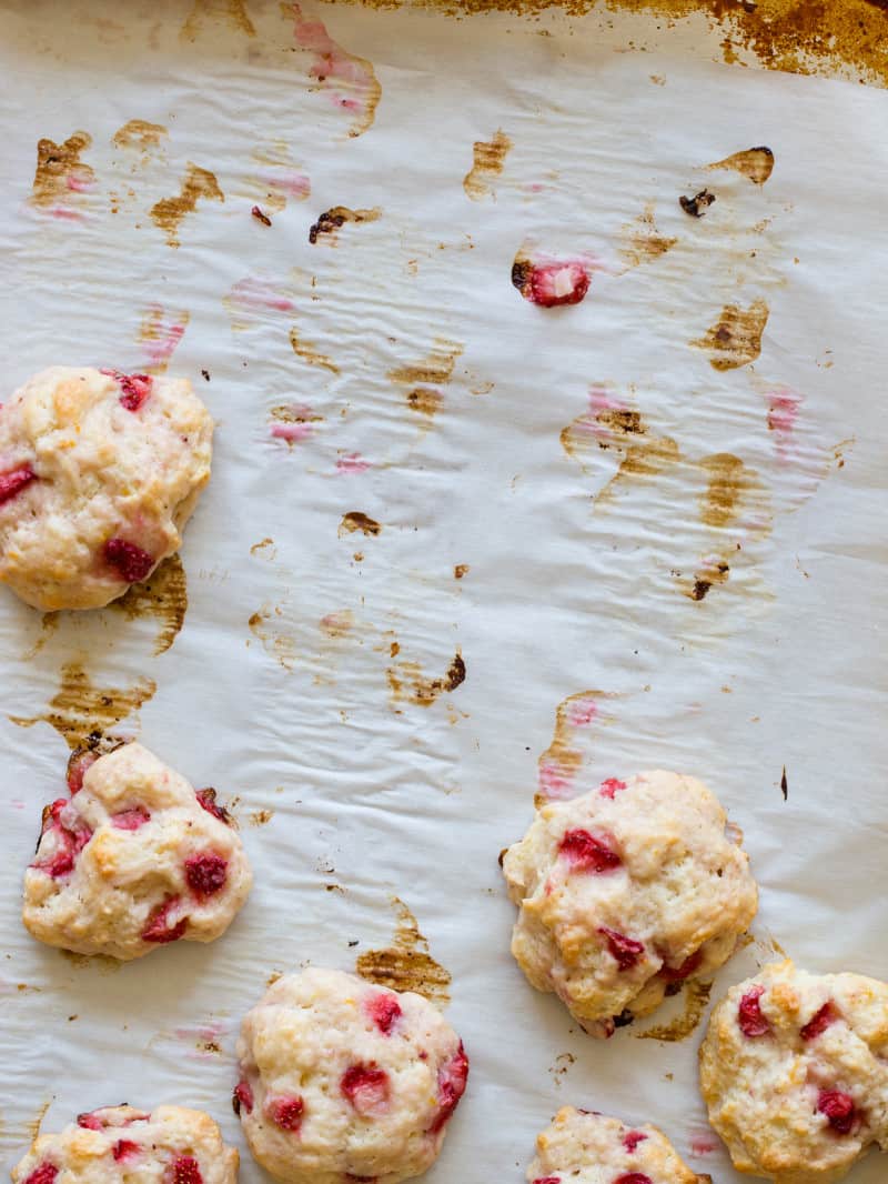 Strawberry shortcake cookies taken off of parchment paper.