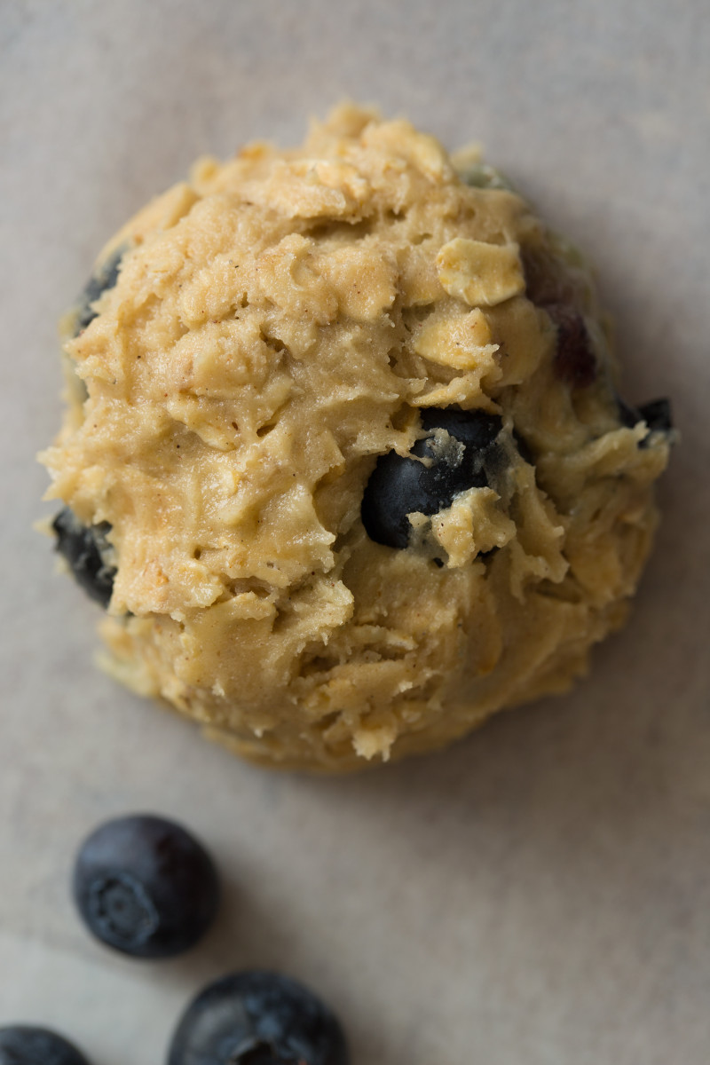 A close up of blueberry and cardamom oat cookies dough ball.