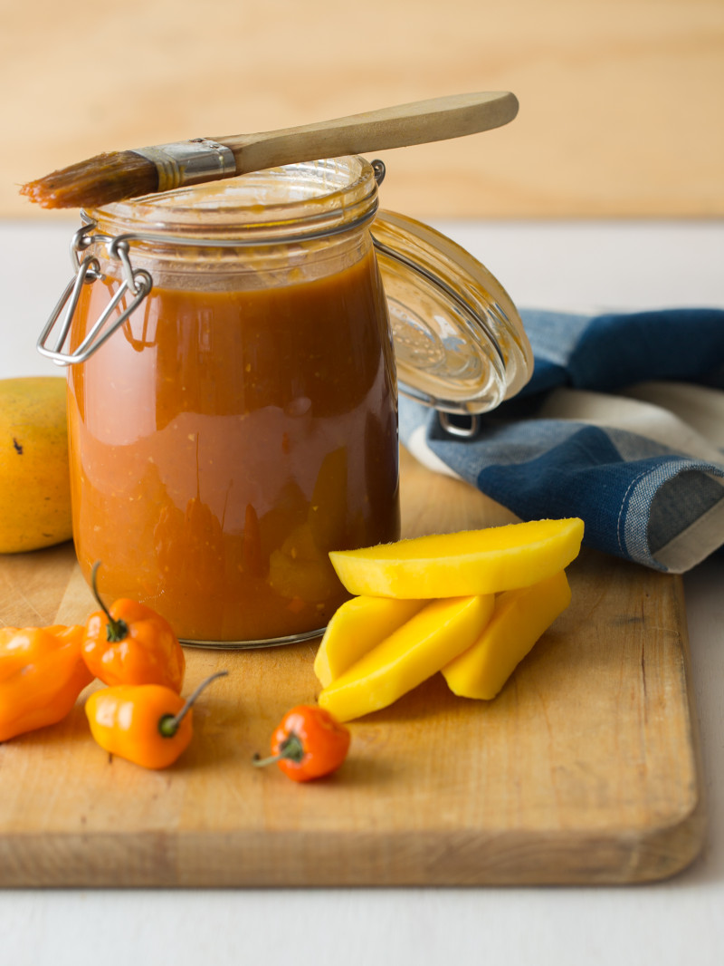 Habanero glaze in a jar with a brush on top to use on spare ribs. 