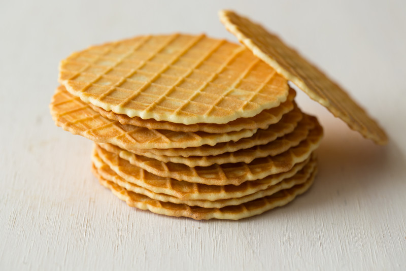 A close up of stacked waffle discs.