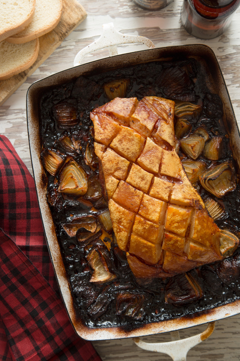 Crispy grilled pork belly in a roasting pan.