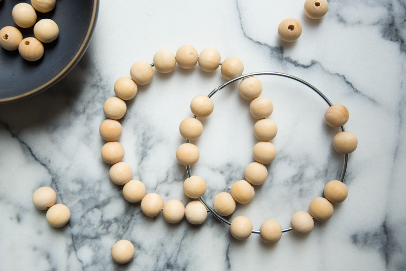 Wooden beads on the wire rings.