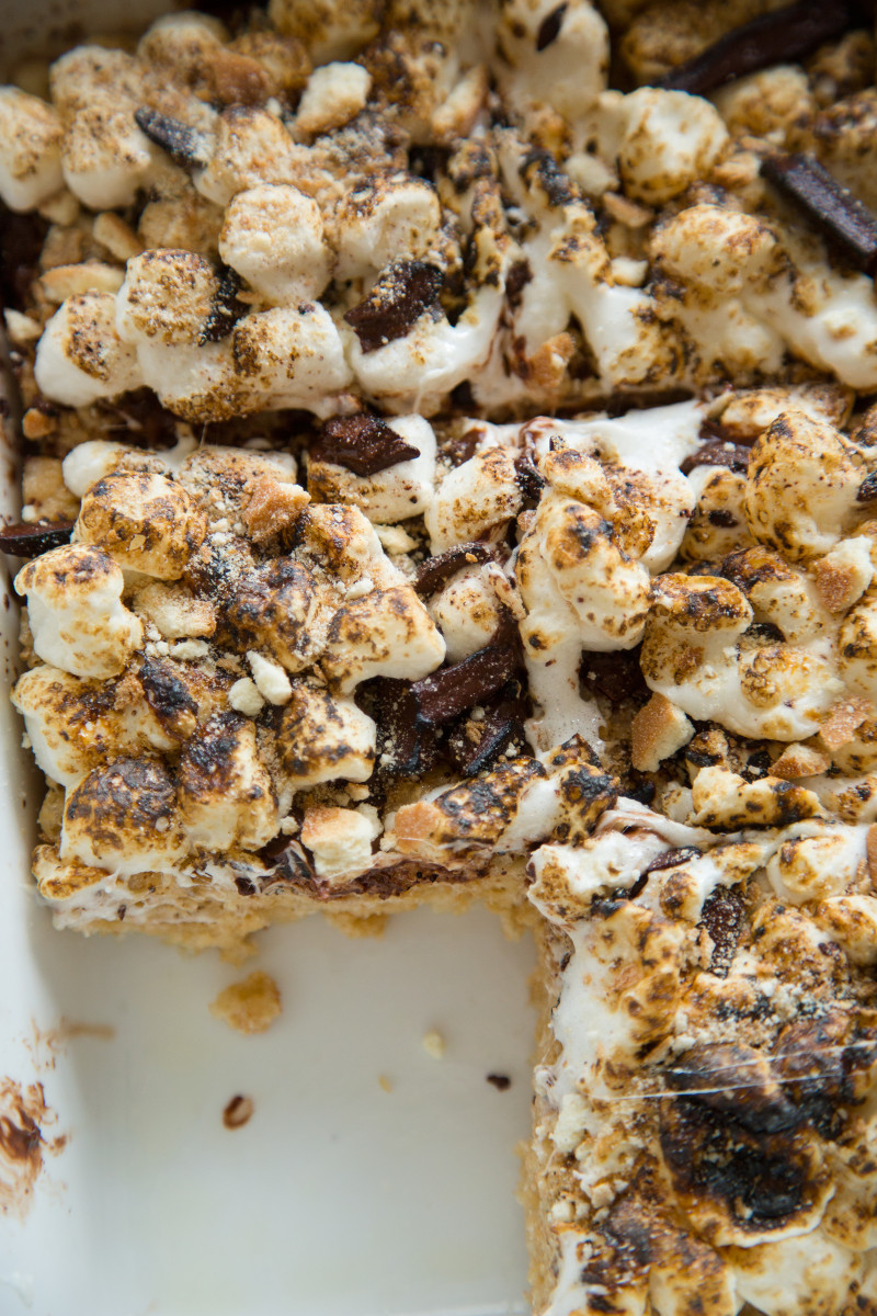 A close up of s\'mores rice krispies treats in the pan with a square taken out.