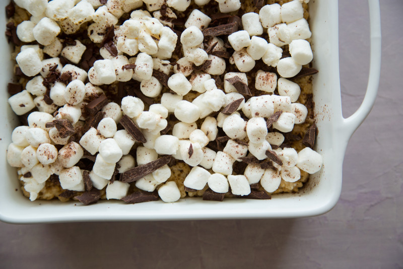 A close up of s\'mores rice krispies treats in a baking pan.