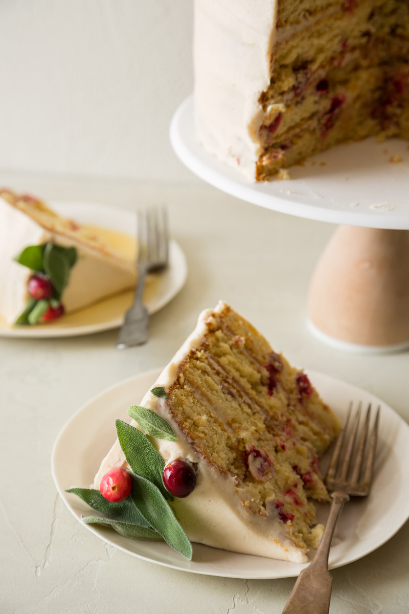 Plated pieces of apple cranberry cake with forks.