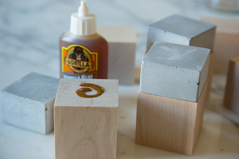 Cement cubes being glued to wooden cubes with Gorilla glue.