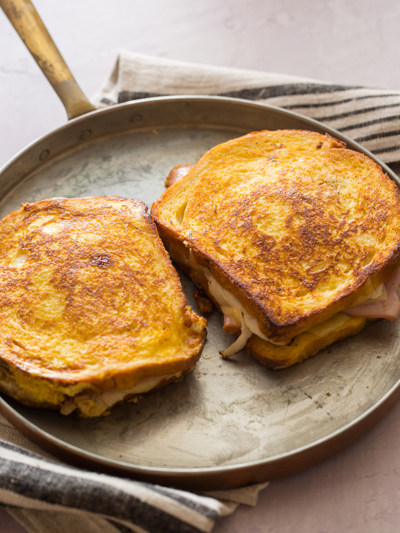 Monte Cristo sandwiches in a skillet.