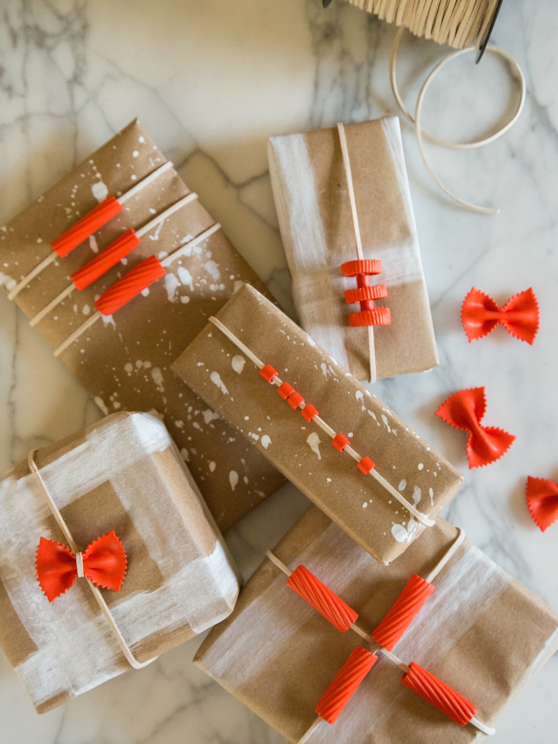 A variety of boxes wrapped in DIY pasta gift wrap.