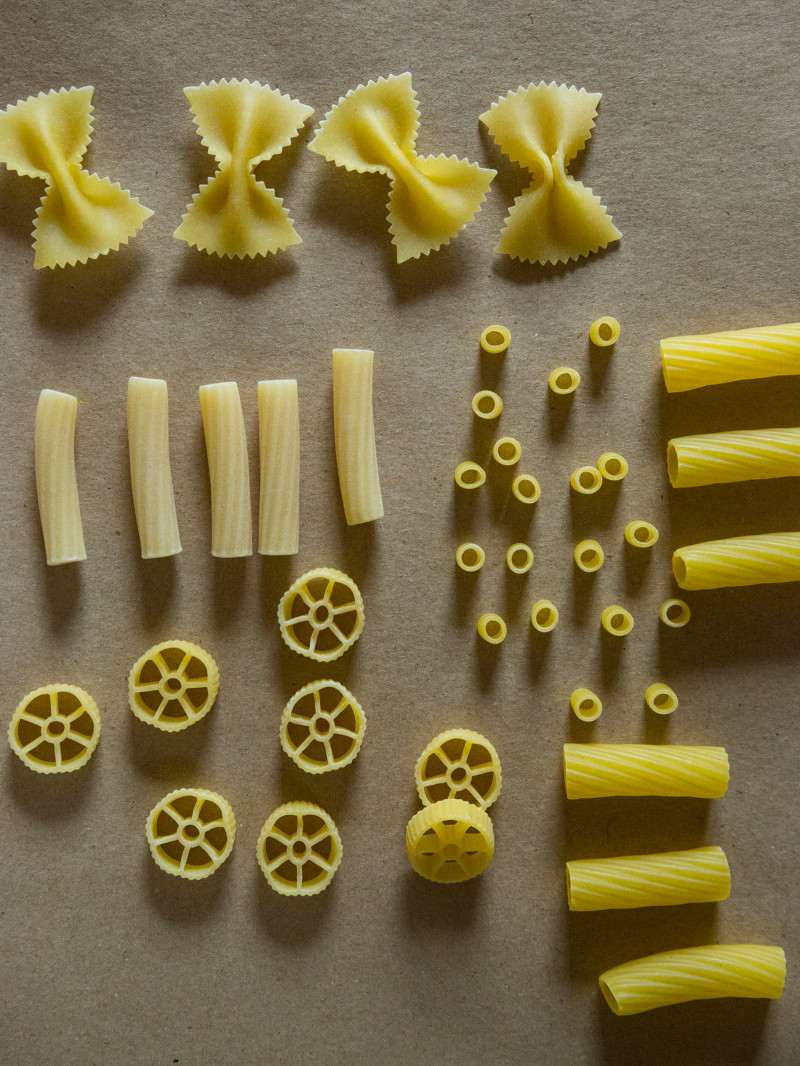 Different types of dry pasta noodles to use for DIY pasta gift wrap.