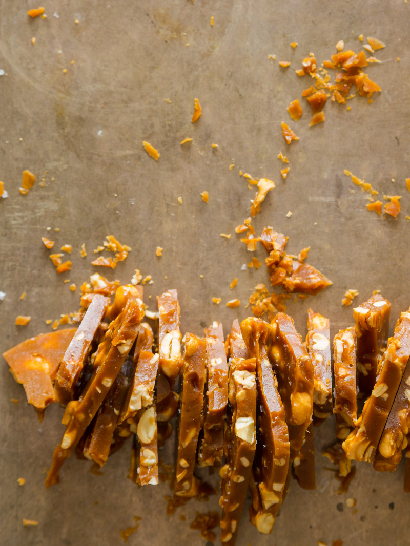 Salted cashew brittle, broken up into strips.