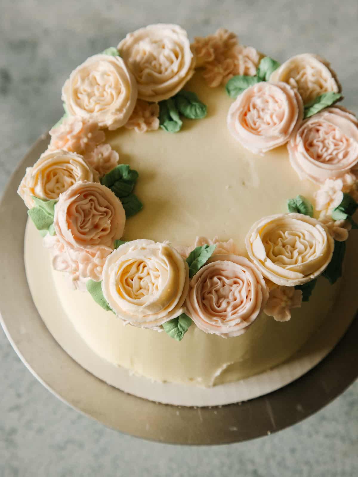 Floral wreath cake on a plate.