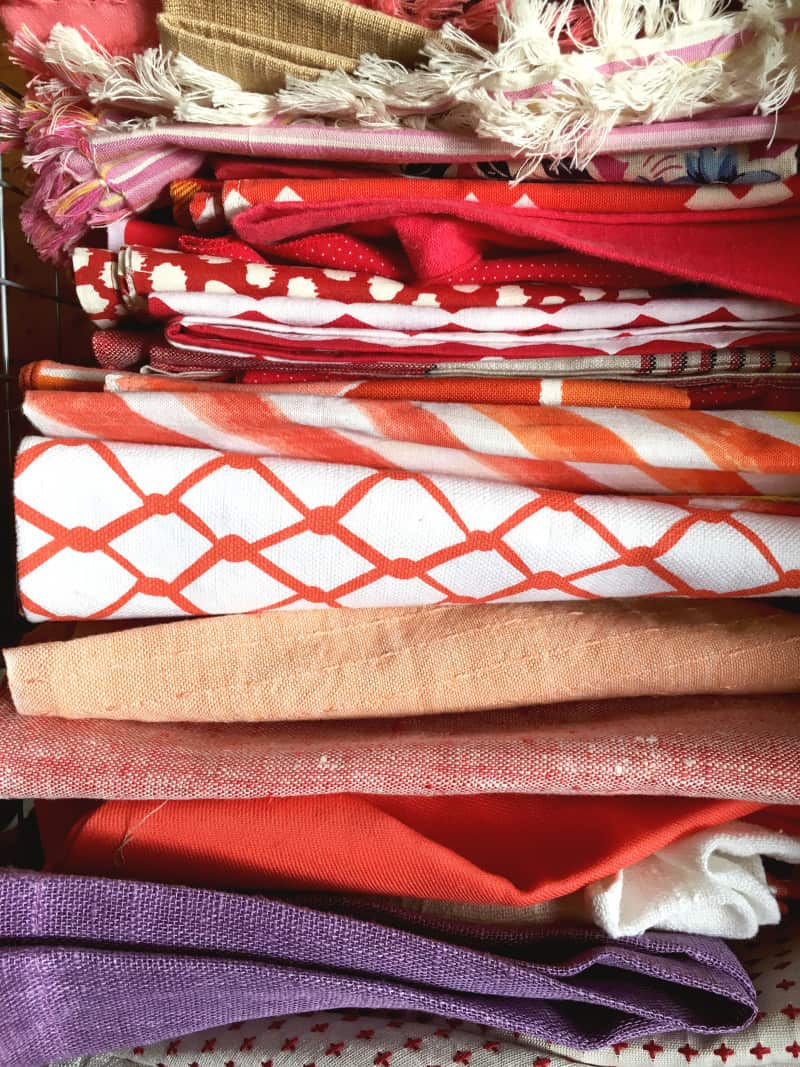 A close up of red and orange napkins.