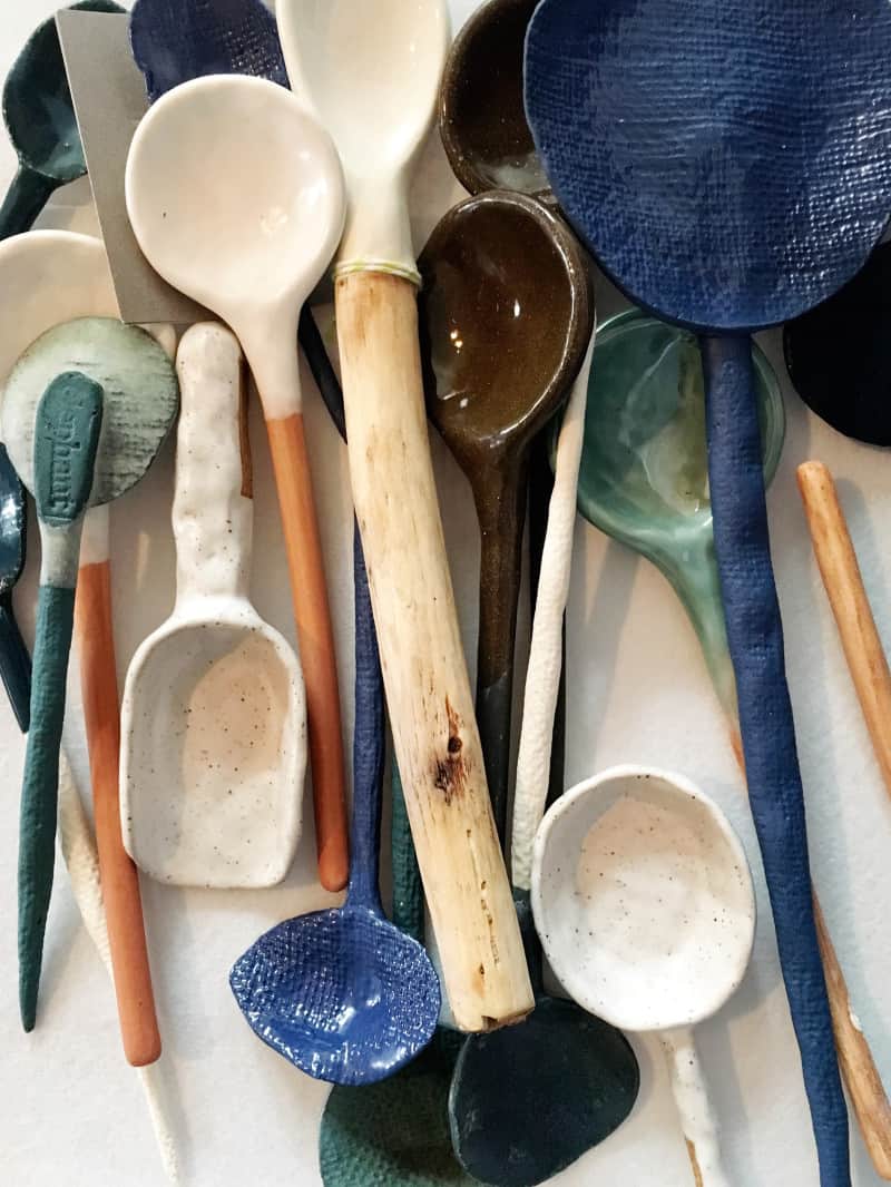 A variety of different colored and sized spoons.