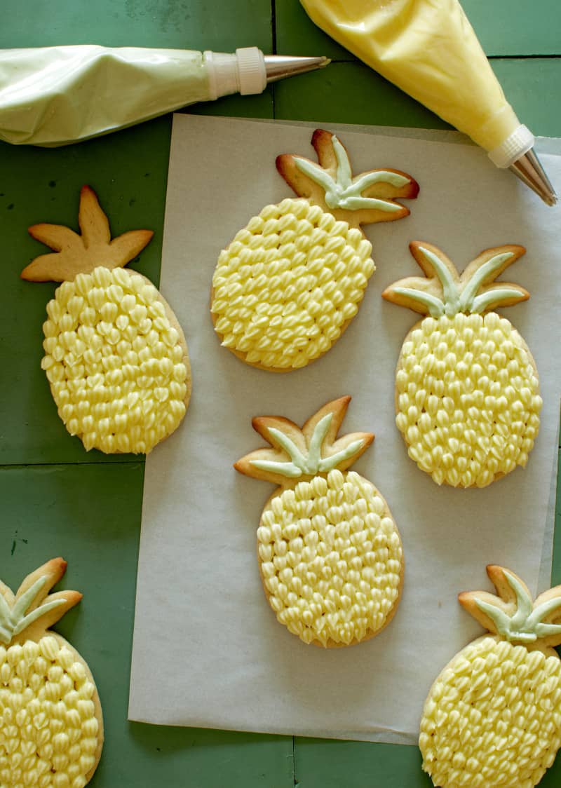 Pineapple shaped lime sugar cookies with pineapple buttercream.