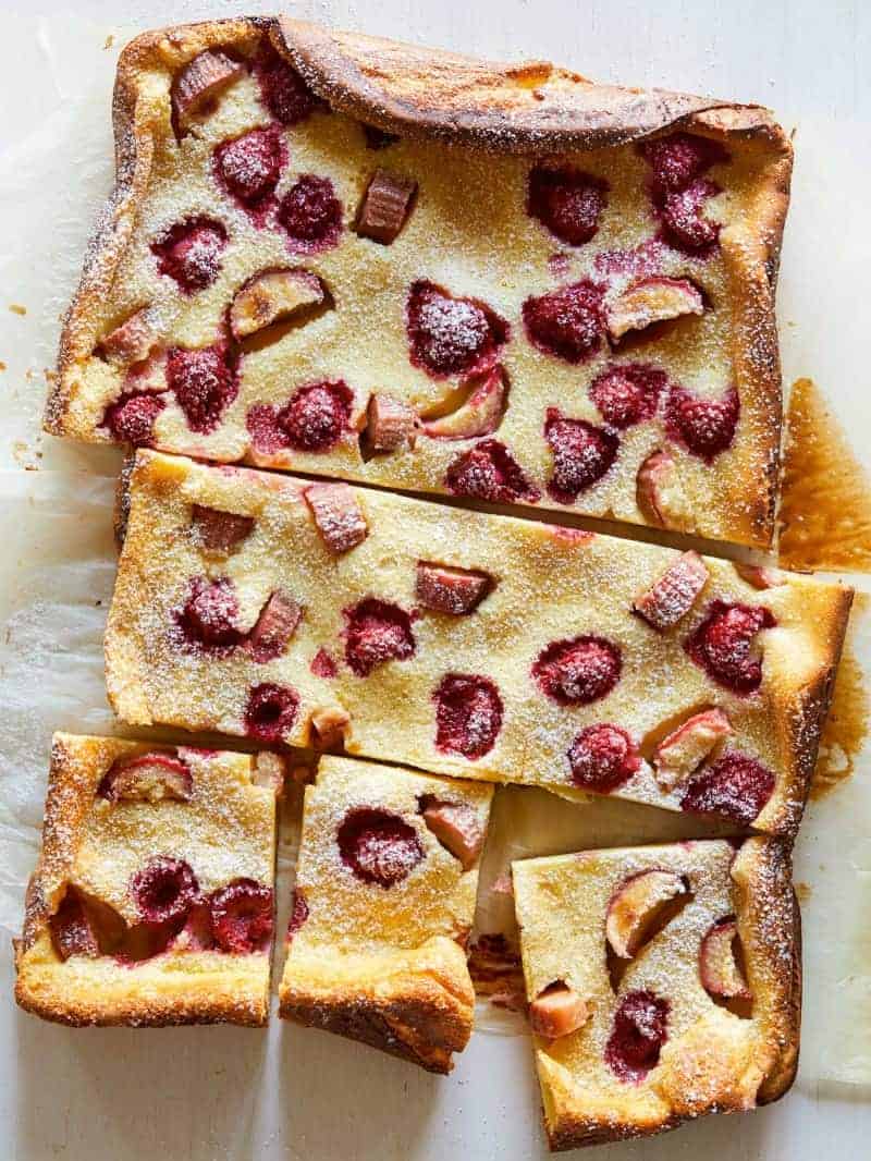 A sliced raspberry rhubarb clafoutis.