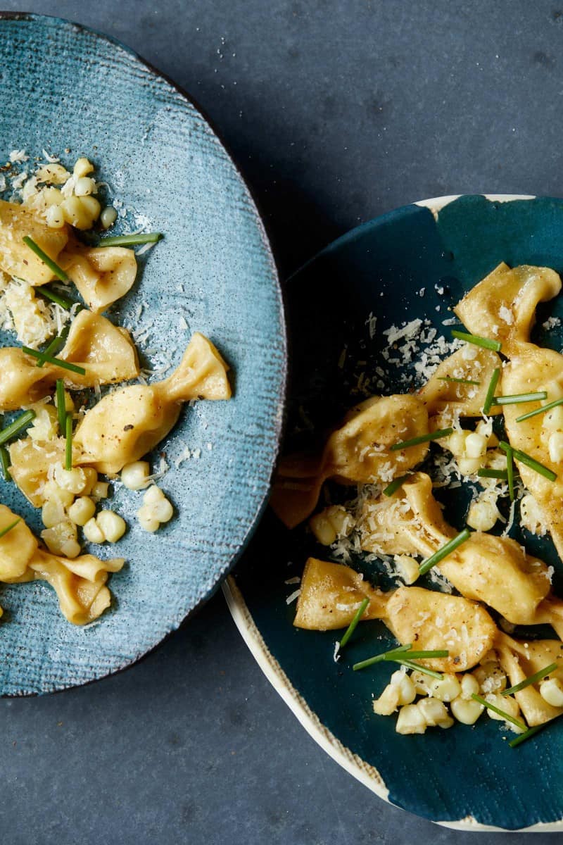 Plates of lobster, corn, and tarragon caramelle.