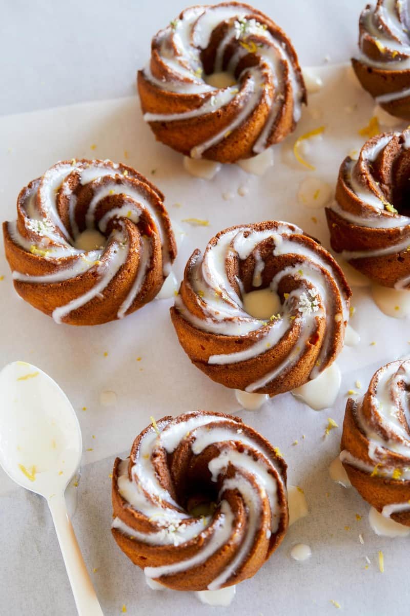 A close up mini citrus bundt cakes with sweet lemon glaze and lemon zest.