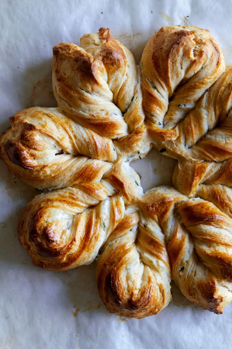 A close up of herb and cheese braided star bread.