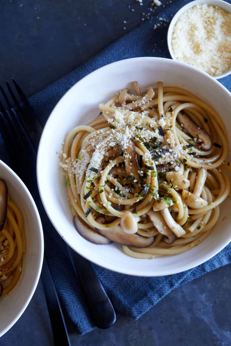 A close up of bowls of wild mushroom wafu pasta with soy butter sauce.