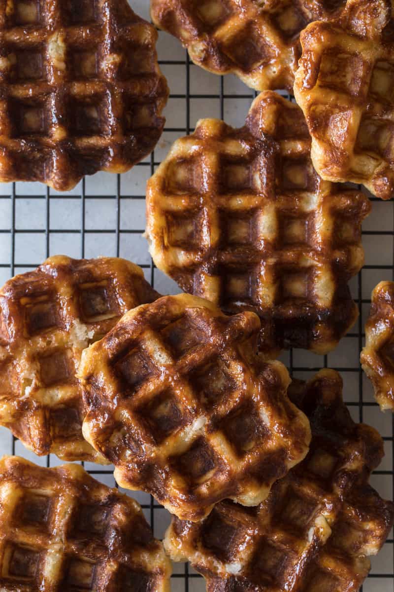 Close up of liege waffles on a cooling rack.