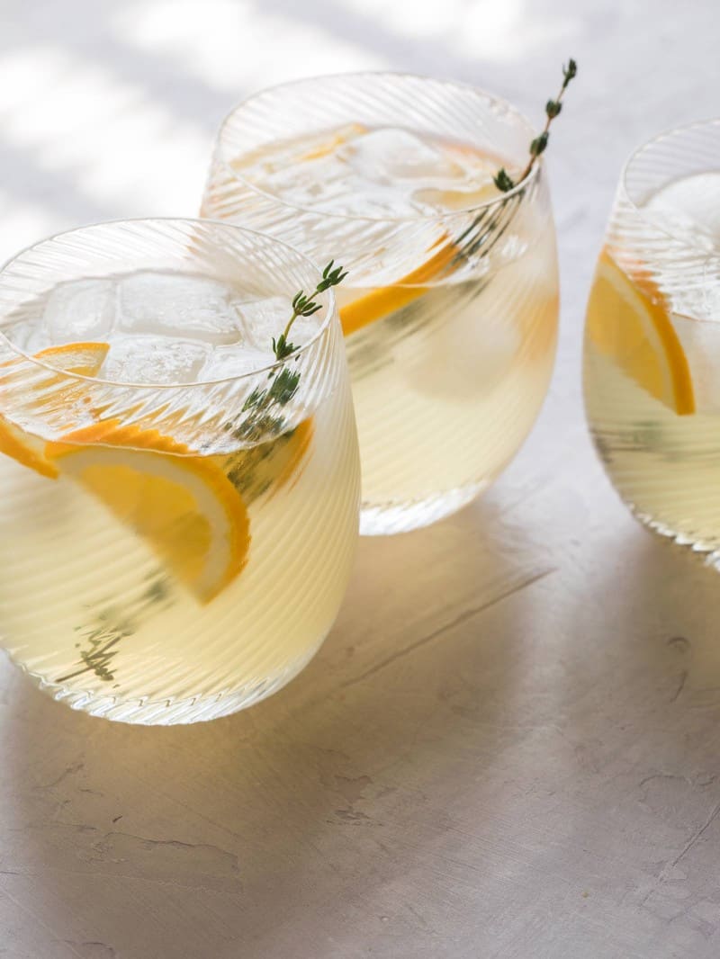 A close up of meyer lemon and thyme bees knees cocktails.