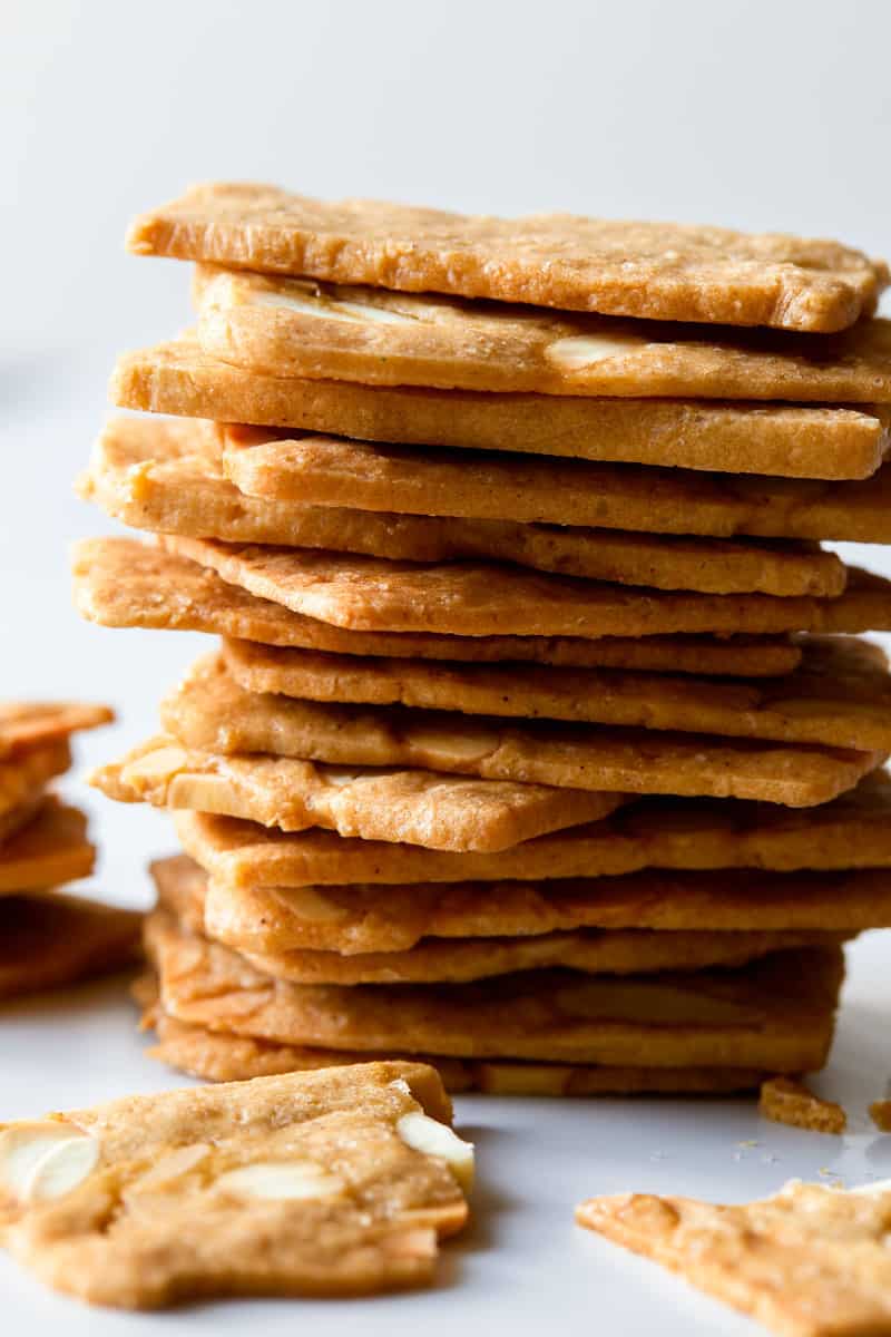 A close up of stacked pain d\'amande cookies.